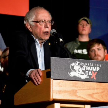 Senator Bernie Sanders urges the audience to speak out against Trump-era policies at his Cedar Rapids rally on Friday, Feb. 23.